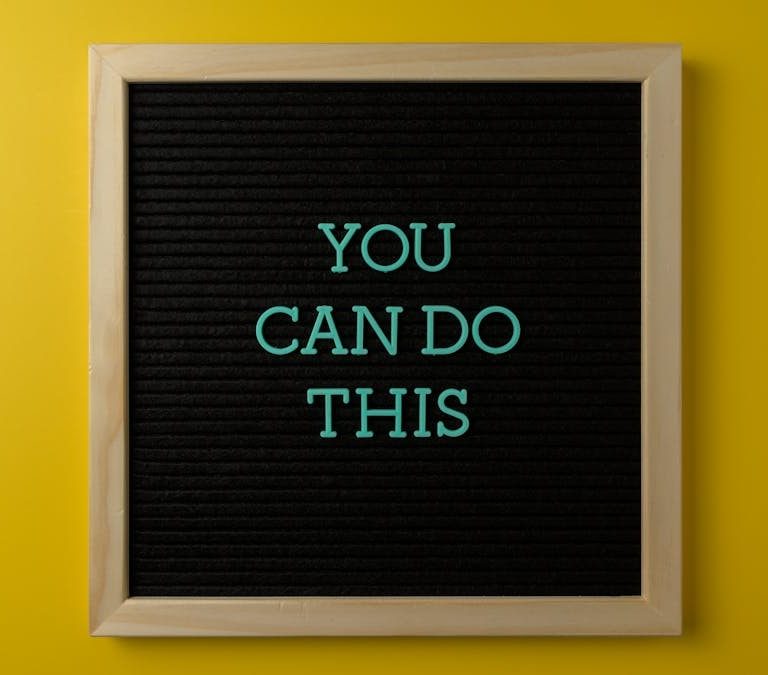 Inspirational message 'You Can Do This' displayed on a blackboard with a bold yellow backdrop.